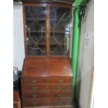 Early C19th inlaid mahogany bureau bookcase, with dentil cornice and two astragal molded doors above