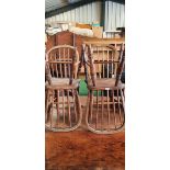 Set of four C19th hoop and stick back dining chairs with solid seats on ring turned supports with