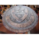 C20th beech occasional table circular top carved with Jesus College Cambridge Crest dated 1910 D36cm