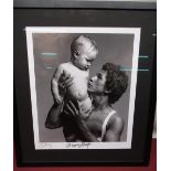 WAYNE SLEEP COLLECTION - Monochrome Clive Arrowsmith photograph of Wayne Sleep holding a baby,