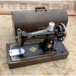 Vintage singer sewing machine with wooden branded cover