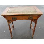 Art Nouveau oak writing table with inset rectangular top and single drawer on tapering splayed