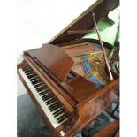 Hagspiel & Comp of Dresden walnut cased baby piano on turned supports