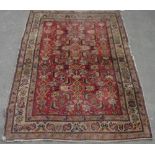 C20th Persian pattern rug, central rust ground with patterned interior surrounded by stylised