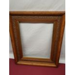 Late Victorian golden oak picture frame swept moulding carved with entwined ivy leaves retaining