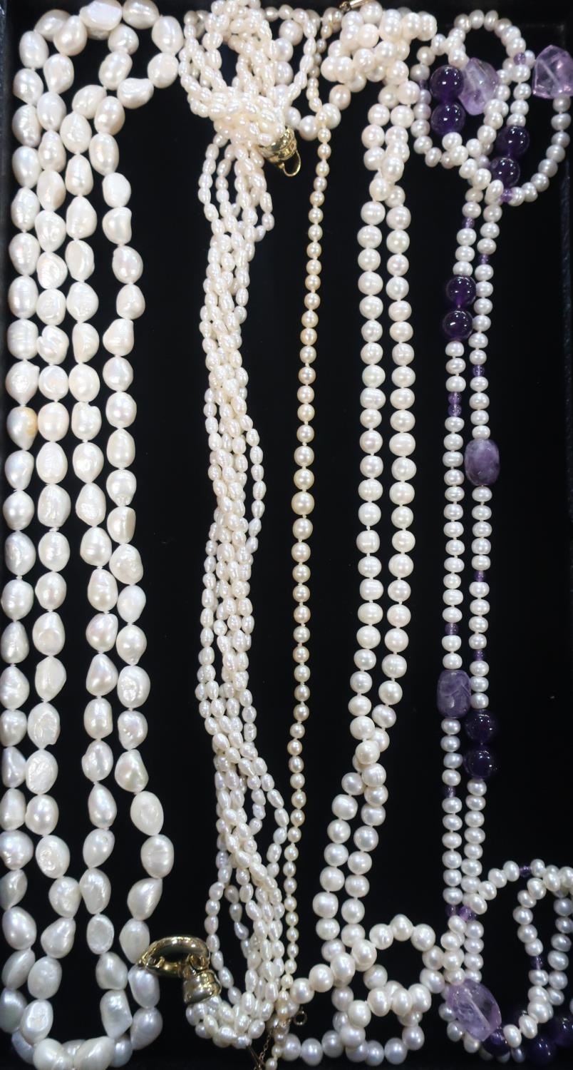 Collection of pearl necklaces including different styles and a simulated pearl necklace with