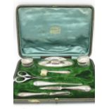 Harrods of London hallmarked sterling silver cased travelling vanity set Henry Matthews, Birmingham,