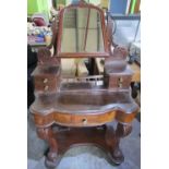 Victorian mahogany serpentine front Duchess type dressing table with arched mirror plate on scroll