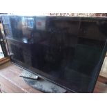 Samsung UE40EH5000KXXU television with remote control
