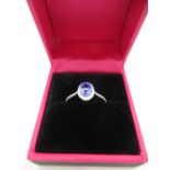 18ct white gold tanzanite and diamond cluster ring of 80 points approx