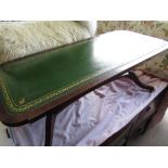 Regency style mahogany rectangular coffee table with inset gilt tooled top on two vase turned