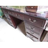 Cheshire Cabinet Company mahogany twin pedestal desk with green inset gilt tooled top and nine