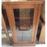 Edwardian mahogany cabinet with glazed door and three shelves on a plinth base W51cm D36cm H95cm