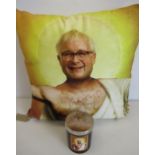 Velour cushion printed with a study of Christopher Biggins, chest partially covered with loin