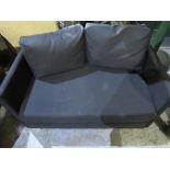 Small modern black upholstered sofa bed, with two loose cushions W109cm H70cm L180cm