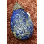 Carved Lapis Lazuli pendant of teardrop form with carved detail and a white metal & marcasite