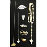 Rosary necklace with carved beads, the cross set with central Stanhope, a silver leaf brooch set