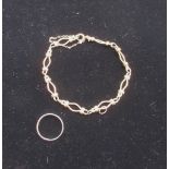 9ct gold chain bracelet with safety chain stamped 9K and a hallmarked 9ct gold wedding band Size M