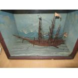 Waterline model of a three masted sailing ship, flying the flag Mary and Ensign in glazed front