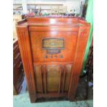 Stromberg-Carlson Cabinet radio with magic eye, walnut case with Bakelite dial and knobs W61cm D30cm