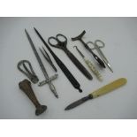Collection of items including letter openers, a seal, tweezers and a glove button hook etc.