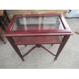 Mahogany bijouterie cabinet, with hinged top on square tapered supports with spade feet joined by