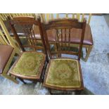 Pair of Edwardian walnut bedroom chairs with spindle turned backs and stuffed over seats on