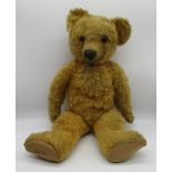 Chad Valley c. 1930s teddy bear in golden mohair, with glass eyes, jointed arms and legs, swivel