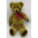 Circa 1950's Pedigree musical teddy bear in golden mohair, with glass eyes, jointed arms and legs