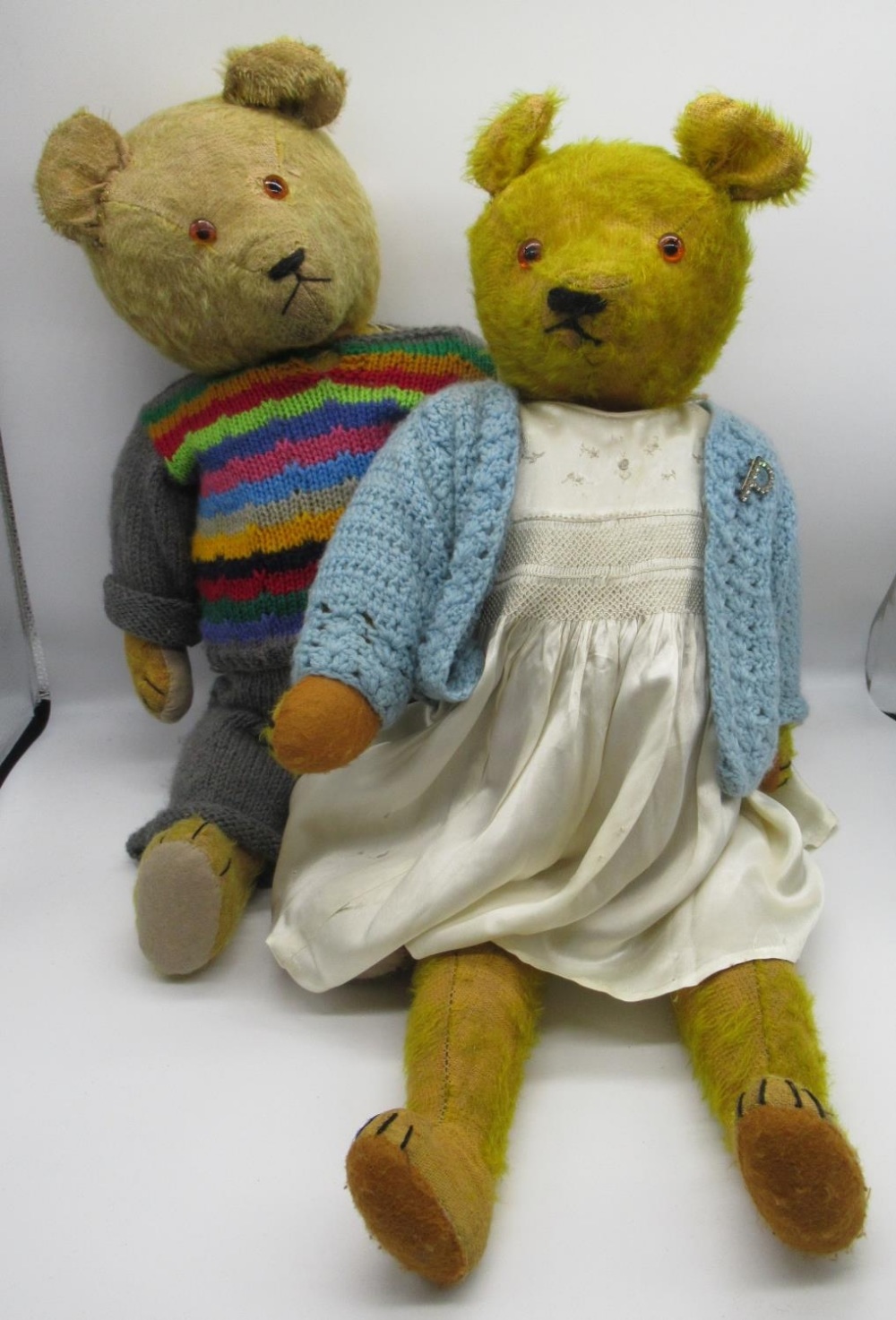 Early C20th American teddy bear in golden mohair with glass eyes jointed arms and legs, stitched