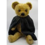 Merrythought c. 1930's teddy bear in golden mohair with glass eyes, label on foot, jointed arms