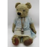 Merrythought c. 1930s teddy bear in blonde mohair with clear glass eyes, Merrythought label on foot,