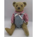 Early C20th unusual teddy bear with boot button eyes and rattle in tummy when shaken, wire