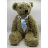 Merrythought 1930's teddy bear in golden mohair with glass eyes, button in ear, label on foot,