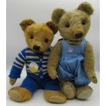 Merrythought c. 1940/50's teddy bear with glass eyes and repaired foot pads, wearing blue romper,