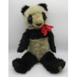 Merrythought c. 1930's panda teddy bear in black and white mohair with clear glass eyes, jointed