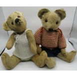 Merrythought c. 1930's teddy bear with glass eyes, jointed arms and legs and swivel head, wearing