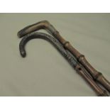 C20th bamboo walking cane with white metal handle and metal ferrule L86cm another similar with