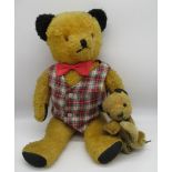 Circa 1940/50's Sooty teddy bear with all original features, wearing a checked waistcoat and red