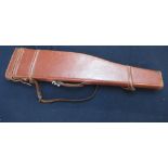 Tan leather Leg-o-Mutton gun case with shoulder strap marked AC