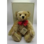 Steiff 1909 Replica Teddy Bear in golden mohair with red ribbon, tag no. 406256, boxed, H40cm