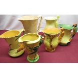 Art Deco Burgess & Leigh Ltd Burleigh Ware jugs: squirrel handle, parrot handles, and three other (