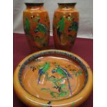 Pair of orange lustre Carlton Ware vases decorated with parrots and foliage H26cm and matching