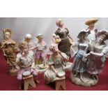 Pair of late C19th Bisque pottery figures of a young man and girl hand painted decoration in the