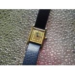 Ladies Cartier Argent quartz gold plated wristwatch, rectangular case on later blue leather strap,