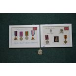 Two framed and mounted WWII British war medal displays: one with desert rat TRAF patch, war medal
