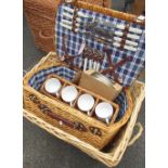 Wicker picnic basket with various cups cutlery etc and a rectangular wicker laundry basket (2)