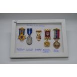 Framed and mounted display of five Order of the Buffalos Lodge medals including Royal Masonic