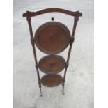 Mahogany three tier folding cake stand on turned supports