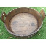 Oak coopered jardinière with two pierced handles and polished metal bands D55cm H22cm